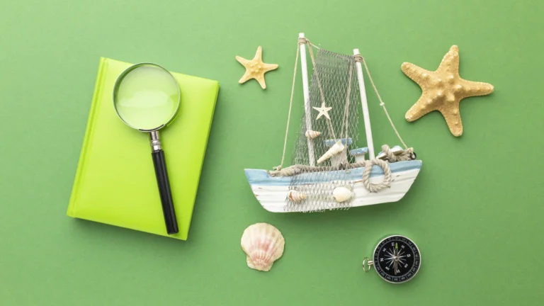 travel-items-green-background-top-view